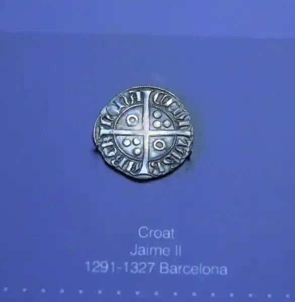 Solar cross on coin
